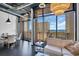 Modern living room with industrial ceiling, open floor plan, sleek furniture, and city view from large windows at 175 2Nd S St # P03, St Petersburg, FL 33701
