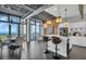 Open-concept living space showcasing an island kitchen, dining area, and breathtaking water views at 175 2Nd S St # P03, St Petersburg, FL 33701