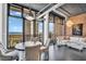 Modern living room featuring waterfront views, exposed brick, elegant decor, and industrial-style ductwork at 175 2Nd S St # P03, St Petersburg, FL 33701
