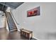 Modern staircase with wooden steps and metal railings leads to the upper level of the home at 175 2Nd S St # P03, St Petersburg, FL 33701