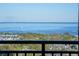 Relaxing view of the serene blue water and distant shoreline from a high-rise balcony at 175 2Nd S St # P03, St Petersburg, FL 33701