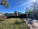 Single Gathering home showcasing a stone facade, covered driveway and mature landscaping at 1905 10Th W St, Palmetto, FL 34221