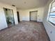 Unfinished living room with hardwood floors, doorways, and window at 1905 10Th W St, Palmetto, FL 34221