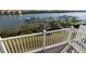 Serene balcony view capturing a marina and lush surroundings, offering a relaxing outdoor experience at 19915 Gulf Blvd # 704, Indian Shores, FL 33785