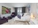 Comfortable bedroom with calming decor, plush seating, and balcony access through elegant sliding glass doors at 19915 Gulf Blvd # 704, Indian Shores, FL 33785