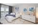 Stylish bedroom with modern decor, plush bedding, and sliding glass doors to a balcony with scenic views at 19915 Gulf Blvd # 704, Indian Shores, FL 33785