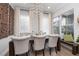 Cozy dining area with decorative wall accents, hardwood floors and natural lighting at 19915 Gulf Blvd # 704, Indian Shores, FL 33785