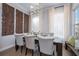 Elegant dining room with a chandelier, hardwood floors, and decorative wall accents at 19915 Gulf Blvd # 704, Indian Shores, FL 33785