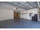 Well-organized garage with epoxy flooring, storage racks, and water filtration system at 19915 Gulf Blvd # 704, Indian Shores, FL 33785
