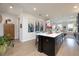 Open-concept kitchen with island seating and seamless flow into the living area, great for entertaining at 19915 Gulf Blvd # 704, Indian Shores, FL 33785
