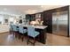 Modern kitchen with dark cabinetry, marble countertops, and stainless steel appliances at 19915 Gulf Blvd # 704, Indian Shores, FL 33785