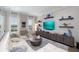 Stylish living room with a comfortable white sectional, wood floors, and tasteful decor at 19915 Gulf Blvd # 704, Indian Shores, FL 33785