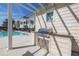 Poolside grill area featuring a stainless steel grill, countertop space, and storage at 19915 Gulf Blvd # 704, Indian Shores, FL 33785