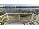 Scenic water view from a private balcony overlooking the marina and waterfront activity at 19915 Gulf Blvd # 704, Indian Shores, FL 33785