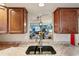 View from kitchen sink into the dining and living areas, creating an open floor plan at 2122 Hailstone Cir, Sun City Center, FL 33573