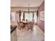 Cozy breakfast nook with a bay window, a charming chandelier, and comfortable seating at 2439 Hidden Trail Dr, Spring Hill, FL 34606