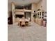 Well-lit dining area with tile flooring, a modern chandelier, and ample space for entertaining at 2439 Hidden Trail Dr, Spring Hill, FL 34606