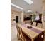 Elegant dining room featuring a skylight, modern lighting, and easy access to living areas at 2439 Hidden Trail Dr, Spring Hill, FL 34606