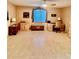 Spacious living room with tile floors, a ceiling fan, and natural light from a window at 2439 Hidden Trail Dr, Spring Hill, FL 34606