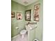 Cozy bathroom featuring a toilet, decorative art, and soft lighting at 2439 Hidden Trail Dr, Spring Hill, FL 34606