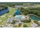 Aerial view of the golf course, community pool, and surrounding lakes at 29443 Zeller Ave, San Antonio, FL 33576