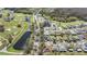 Aerial view of the property, showing its location near a golf course, pond, and community amenities at 29443 Zeller Ave, San Antonio, FL 33576