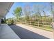 Enjoy the view from this back deck with wood railing overlooking a wooded lot at 29443 Zeller Ave, San Antonio, FL 33576