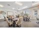 Inviting common room with tables, comfortable seating, and abundant natural light, perfect for meetings or social gatherings at 29443 Zeller Ave, San Antonio, FL 33576