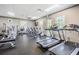 Bright fitness center featuring treadmills, stationary bikes, and various exercise machines at 29443 Zeller Ave, San Antonio, FL 33576