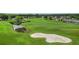 Lush green golf course with ponds, sand traps, and a winding cart path at 29443 Zeller Ave, San Antonio, FL 33576