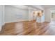 Bright and airy living room with wood flooring and open floor plan to kitchen at 29443 Zeller Ave, San Antonio, FL 33576