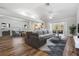Bright open-concept living space with hardwood floors, modern decor, and plenty of natural light at 29443 Zeller Ave, San Antonio, FL 33576