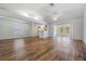 Open living room features hardwood floors, high ceilings, and lots of natural light at 29443 Zeller Ave, San Antonio, FL 33576
