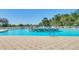 Expansive swimming pool featuring inviting lounge chairs and a central water fountain at 29443 Zeller Ave, San Antonio, FL 33576