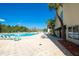 Resort style pool featuring abundant lounge seating and lush greenery at 29443 Zeller Ave, San Antonio, FL 33576