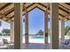 View of the community pool featuring a covered lounging area with high ceilings and tiled flooring at 29443 Zeller Ave, San Antonio, FL 33576