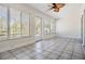 Bright sunroom with tile flooring, natural light, and access to the outdoors at 29443 Zeller Ave, San Antonio, FL 33576