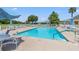 Enjoy a refreshing dip in the community's outdoor pool, complete with comfortable lounge chairs and beautiful landscaping at 29443 Zeller Ave, San Antonio, FL 33576