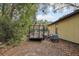 Backyard with trailer and tools around the house at 303 Grand Ave, Brooksville, FL 34604