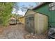 View of shed and trailer in the backyard of the property at 303 Grand Ave, Brooksville, FL 34604