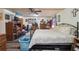 This ample bedroom has a ceiling fan and a wall-mounted television at 303 Grand Ave, Brooksville, FL 34604