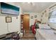 A tidy bedroom is equipped with a wall-mounted television and space for sleeping, entertainment, and storage at 303 Grand Ave, Brooksville, FL 34604