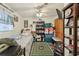 A compact bedroom features a ceiling fan, television, and space for sleeping and storage at 303 Grand Ave, Brooksville, FL 34604