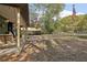 Spacious porch with a swing, seating, and views of the surrounding yard at 303 Grand Ave, Brooksville, FL 34604