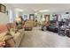 Spacious living room with comfortable seating, ceiling fan, and lots of space at 303 Grand Ave, Brooksville, FL 34604