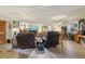Large living room featuring lots of space, a large TV, and ceiling fan at 303 Grand Ave, Brooksville, FL 34604