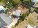Aerial view of home with a spacious yard, detached garage and in ground pool at 305 6Th Sw Ave, Largo, FL 33770