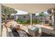 Covered outdoor patio with outdoor furniture overlooking a grassy backyard at 305 6Th Sw Ave, Largo, FL 33770
