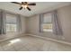 Bedroom with neutral walls, tile flooring, and window blinds at 305 6Th Sw Ave, Largo, FL 33770