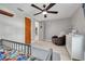 Bedroom with grey walls, a ceiling fan, and tile flooring at 305 6Th Sw Ave, Largo, FL 33770